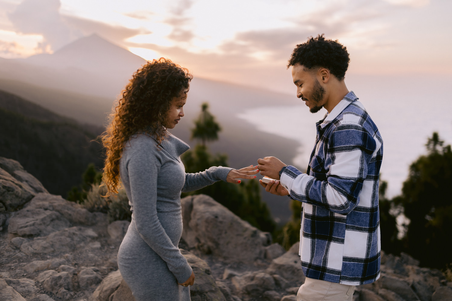Couple getting engaged in Tenerife with mount teide in the background during a chipeque proposal
