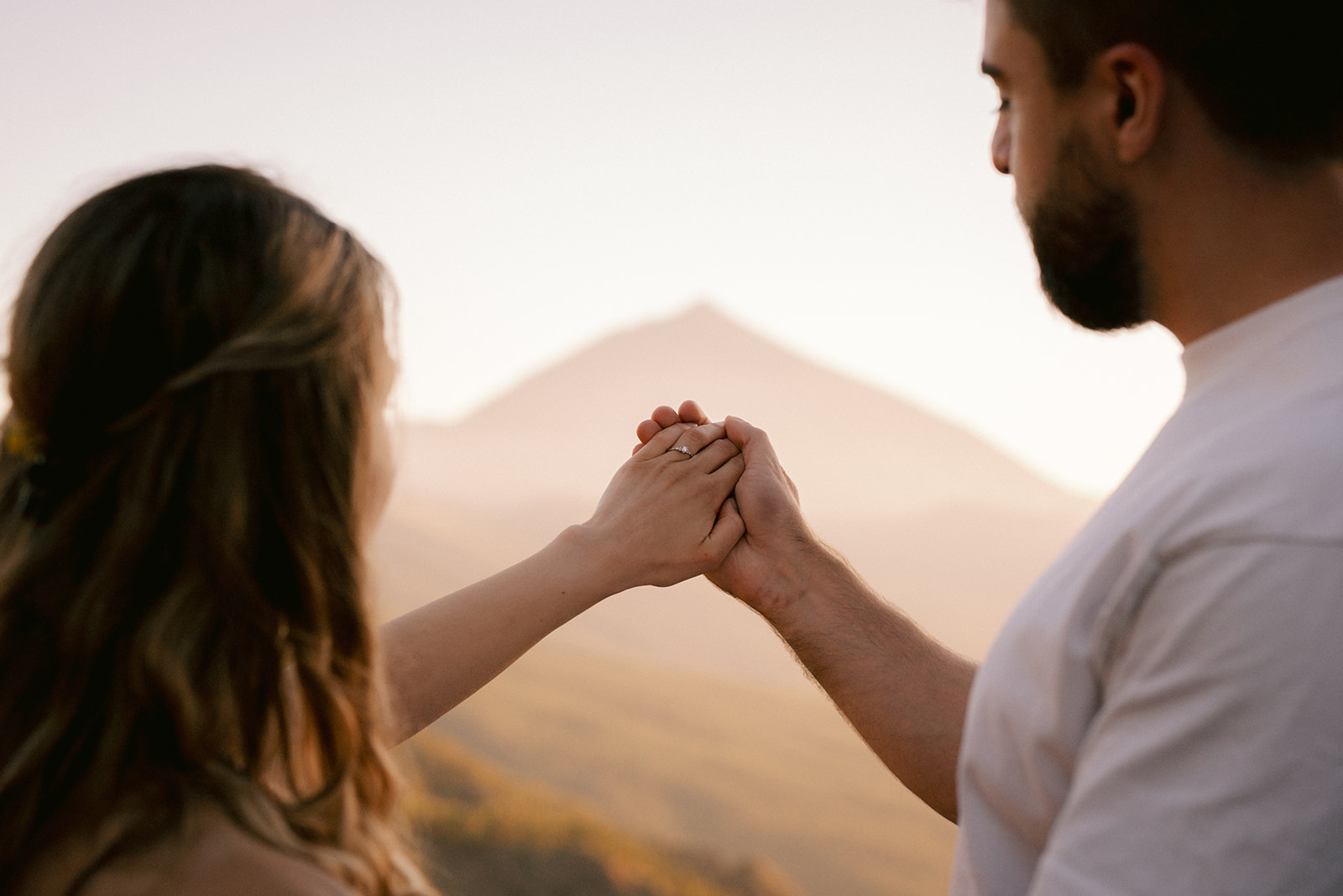 Engagement at Mount Teide with the volcano in the background of the couple 
